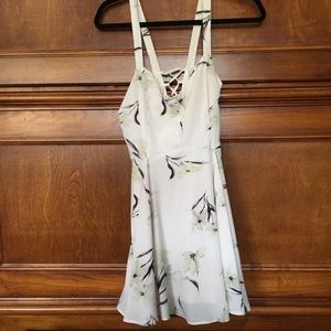 A light pink floral dress with a lace up back